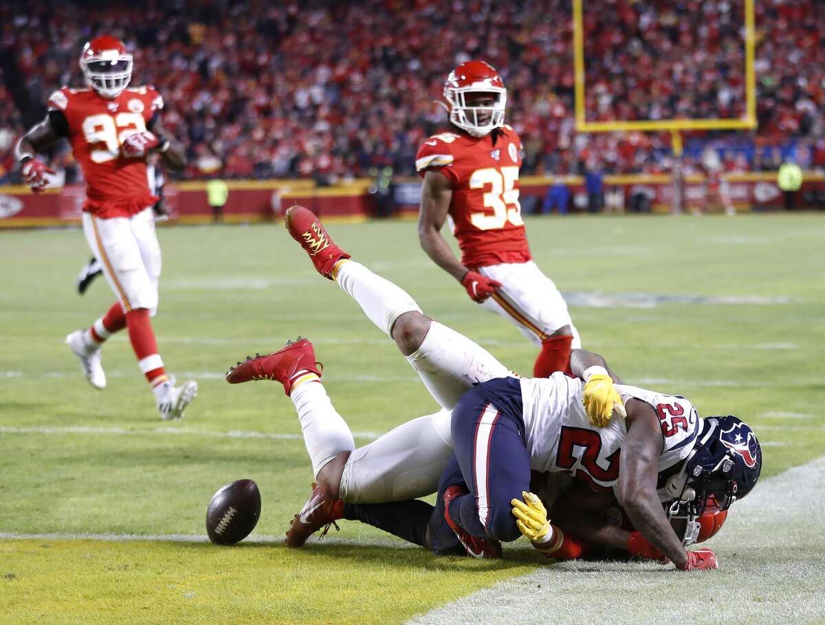 Houston Texans running back Duke Johnson (25) gets brought down near the goal line by a Kansas City Chiefs defender in the fourth quarter of an AFC divisional playoff game at Arrowhead Stadium on Sunday, Jan. 12, 2020, in Kansas City, Mo.