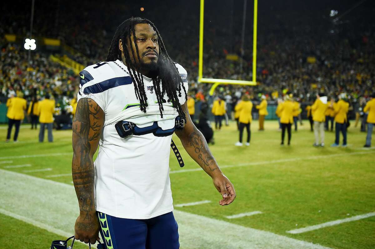 Marshawn Lynch #24 of the Seattle Seahawks looks on before the NFC Divisional Playoff game against the Green Bay Packers at Lambeau Field on January 12, 2020 in Green Bay, Wisconsin. (Photo by Stacy Revere/Getty Images)