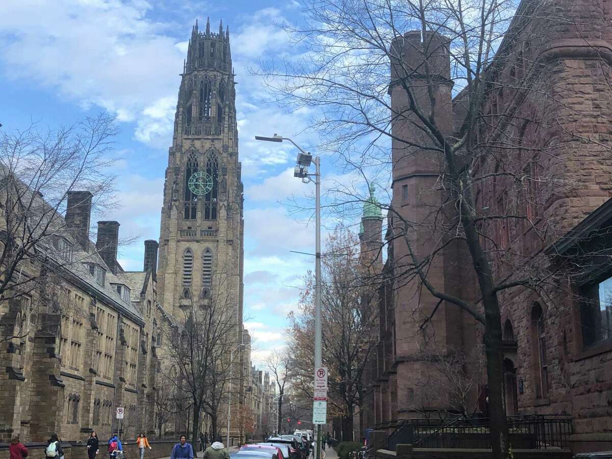 A view down High Street on the Yale University campus in New Haven, Connecticut, with Harkness Tower at left and Linsly-Chittenden Hall at right. Dwight Hall lies beyond Linsly-Chittenden; both are part of the Old Campus quad.