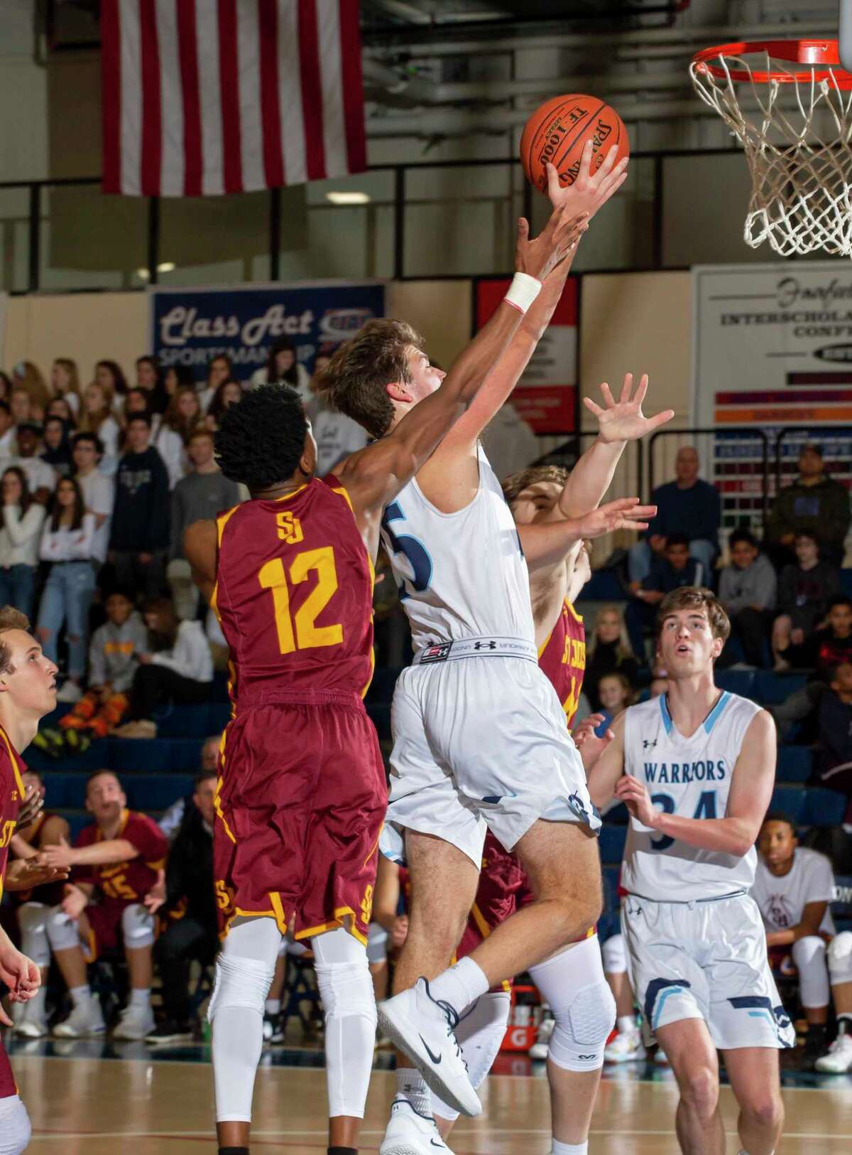 Kyle Hyzy (shown against St. Joseph earlier this season) scored 26 points as Wilton rallied to beat Westhill on Friday night.