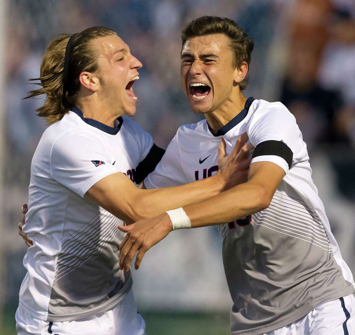 Austin DaSilva of Brookfield, right, celebrates his first collegiate goal for the UConn men's soccer team with teammate Niko Petridis of Norwalk. UConn played to a 1-1 tie with Georgetown Sept. 9, 2017 in Storrs.