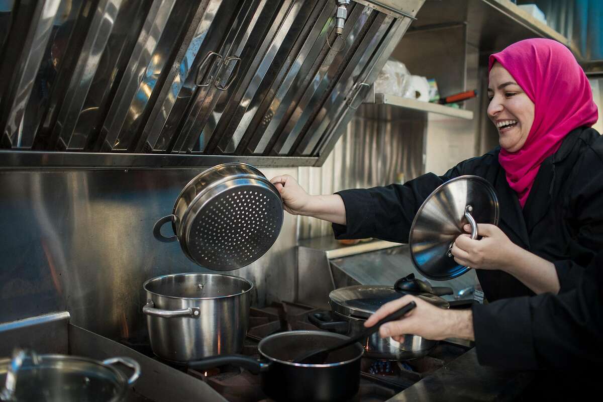 Wafa Bahloul shows the cooking substitute she uses to make cous cous at her Algerian food truck, Kayma on December 22, 2019 on Treasure Island in San Francisco, California.