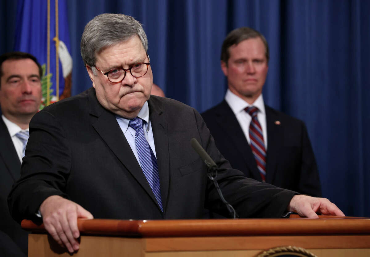 WASHINGTON, DC - JANUARY 13: U.S. Attorney General William Barr (C) speaks during a press conference on the shooting at the Pensacola naval base January 13, 2020 in Washington, DC. Barr said the Justice Department’s investigation determined the shooting "was an act of terrorism" that was "motivated by jihadist ideology". Barr said Apple has not provided "substantive" assistance in accessing the shooter's iPhones, but Apple pushed back, saying it has provided "gigabytes" of data.