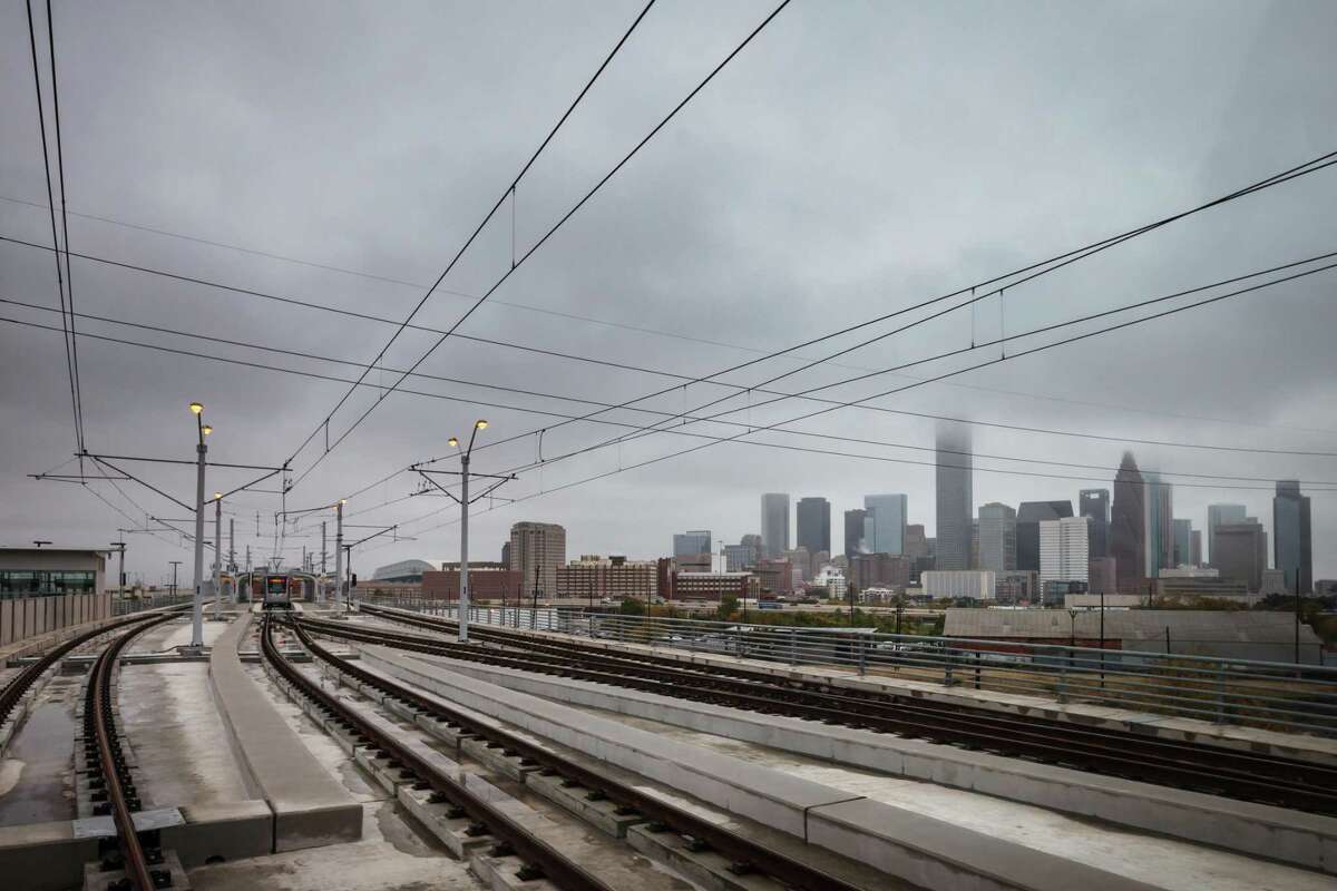 METRORail's Burnett Transit Center, near the site of the NRP mixed-income residential development, overlooks the downtown Houston Skyline while traveling on the North/Red Line.