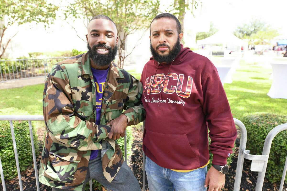 Frank North, right, and Cameron Burrell attend the Texas Southern University homecoming football game in October 2019. North, a clinical pharmacist and Houston ISD alumnus, is one of nearly 250 people who applied to join the district’s replacement school board.