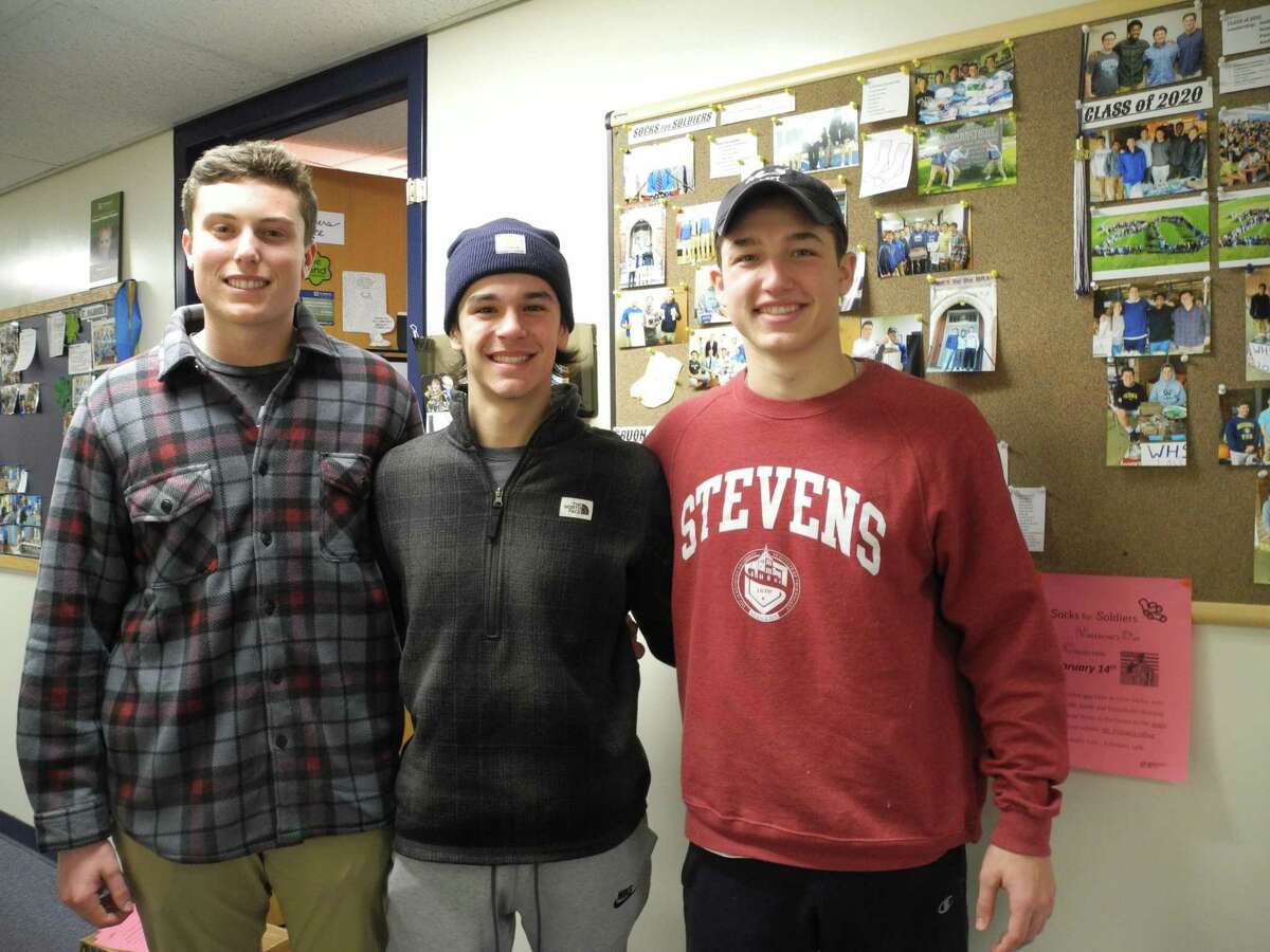 From left, Jack Savarese, Connor Burke and Jake Zeyher are this year’s leaders of Socks for Soldiers at Wilton High School.