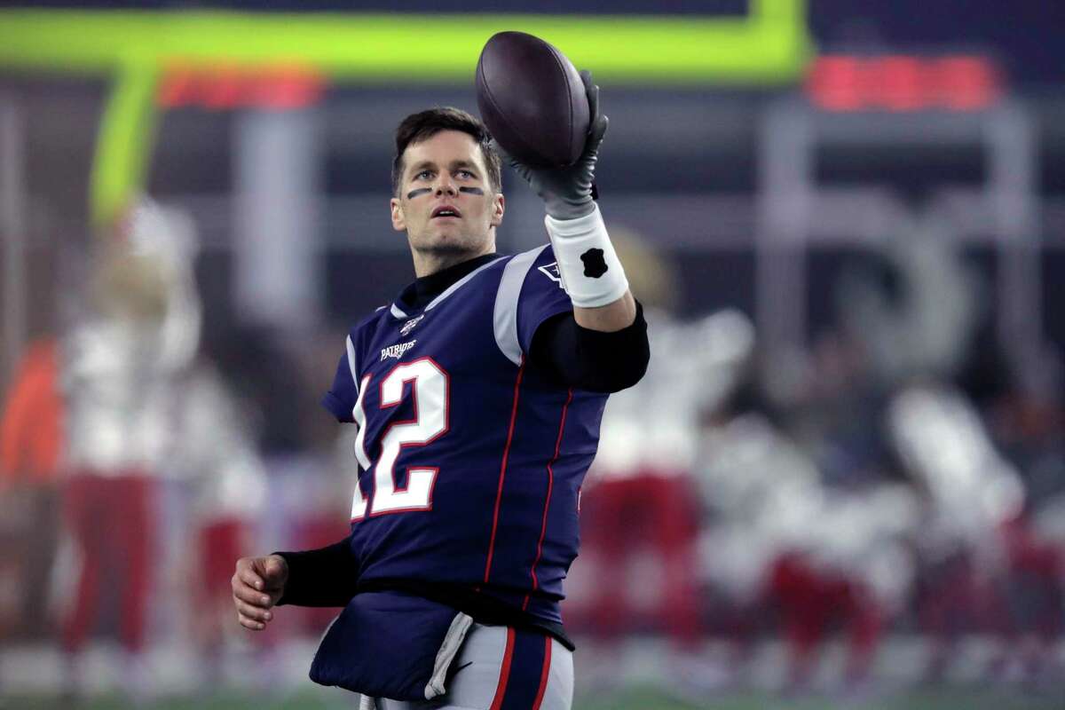 New England Patriots quarterback Tom Brady warms up before an NFL wild-card playoff football game against the Tennessee Titans, Saturday, Jan. 4, 2020, in Foxborough, Mass. (AP Photo/Charles Krupa)