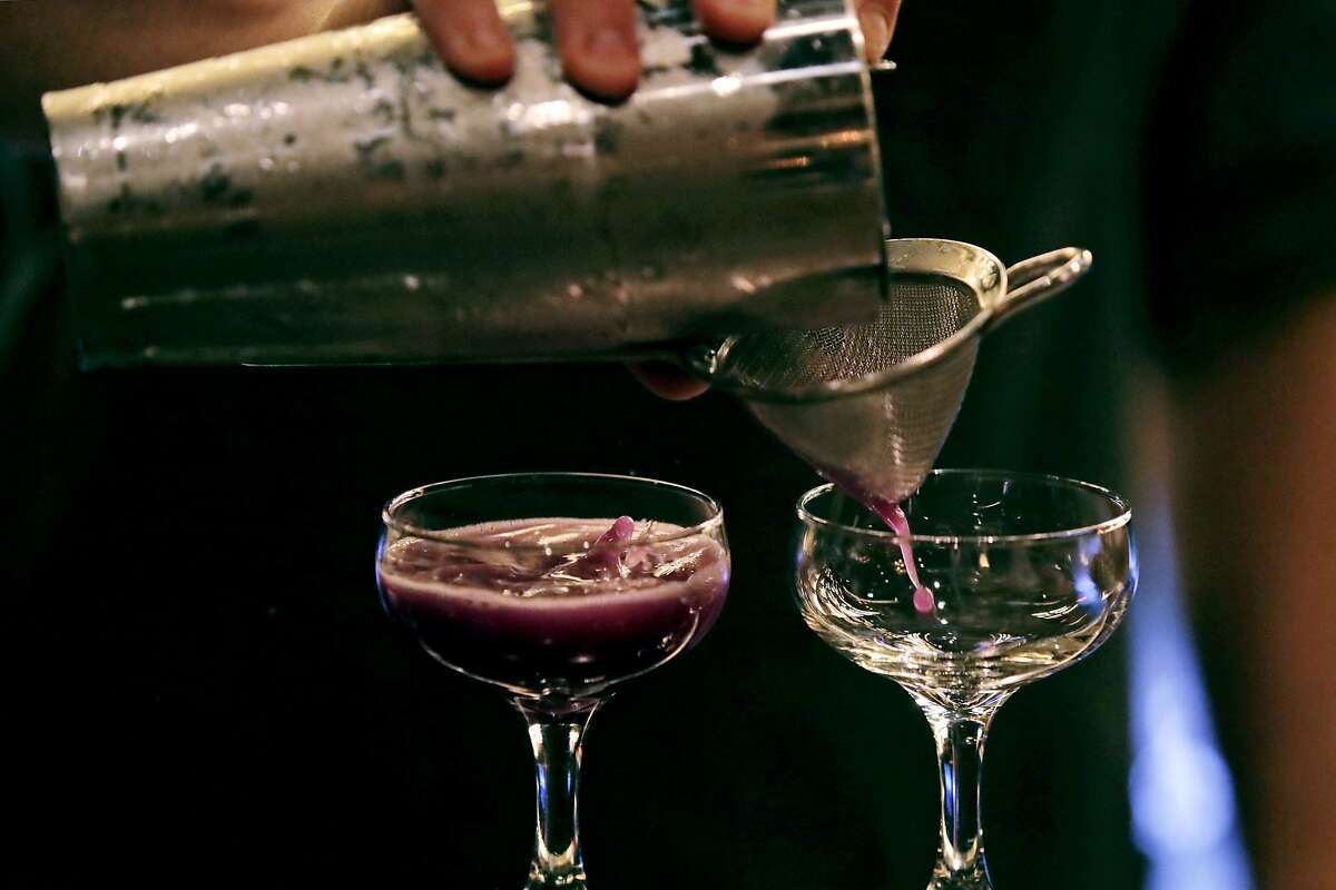 In this Dec. 10, 2019, photo cocktails are crafted at Wink & Nod, basement-dwelling, speakeasy-like bar, in Boston. Americans are consuming more alcohol per capita now than in the time leading up to Prohibition, when alcohol opponents successfully made the case that excessive drinking was ruining family life. (AP Photo/Charles Krupa)