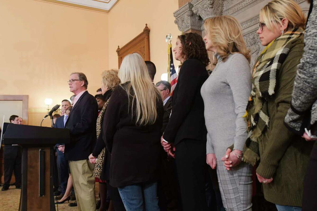 Families who lost loved ones in the Schoharie limo crash look on as Kevin Cushing, at podium, speaks at a press conference at the Capitol about new limo safety regulations on Tuesday, Jan. 14, 2020, in Albany, N.Y. Kevin Cushing lost his son Patrick Cushing in the Schoharie limo crash. (Paul Buckowski/Times Union)
