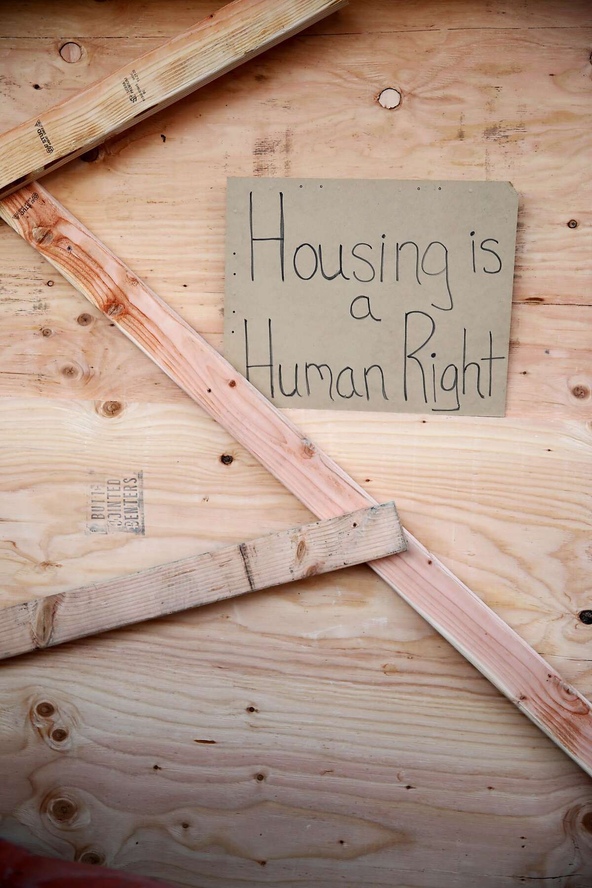 A homemade sign reading, "Housing is a human right," was placed on the boarded garage door following an eviction of the Moms 4 Housing group from the Magnolia Street house the homeless mothers had been occupying in Oakland, Calif., on Tuesday, January 14, 2020. Moms 4 Housing members Misty Cross and Tolani King were arrested. A third person, Jesse Turner, was also arrested. A judge on Friday ruled that Moms 4 Housing didn't have a legal right to the property and that they would be evicted by the Sheriff's Office within days.