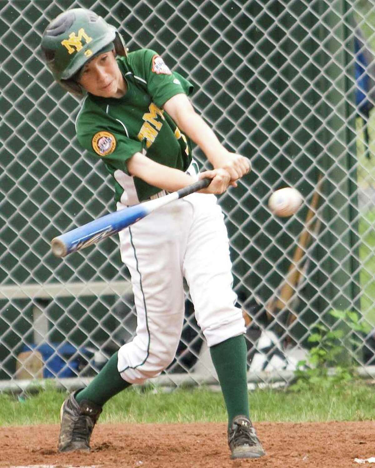 New Milford's Paul Dobies singles in a run against Exeter, N.H., in the Cal Ripken 11-year-old New England Regional Tournament Thursday in New Milford.