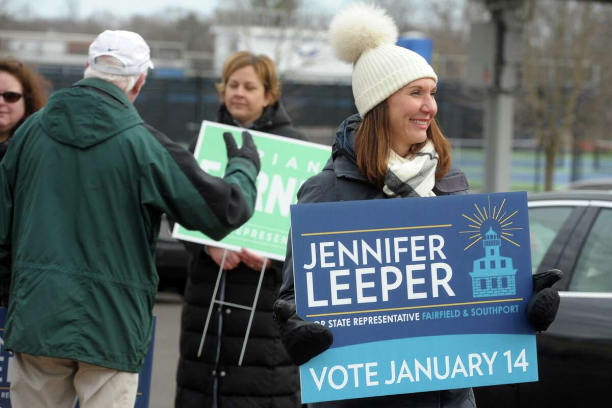Democrat Jennifer Leeper greets voters outside Fairfield Ludlowe High School, in Fairfield, Conn. Jan. 14, 2020. Leeper is a candidate for the 132nd House of Representatives seat.