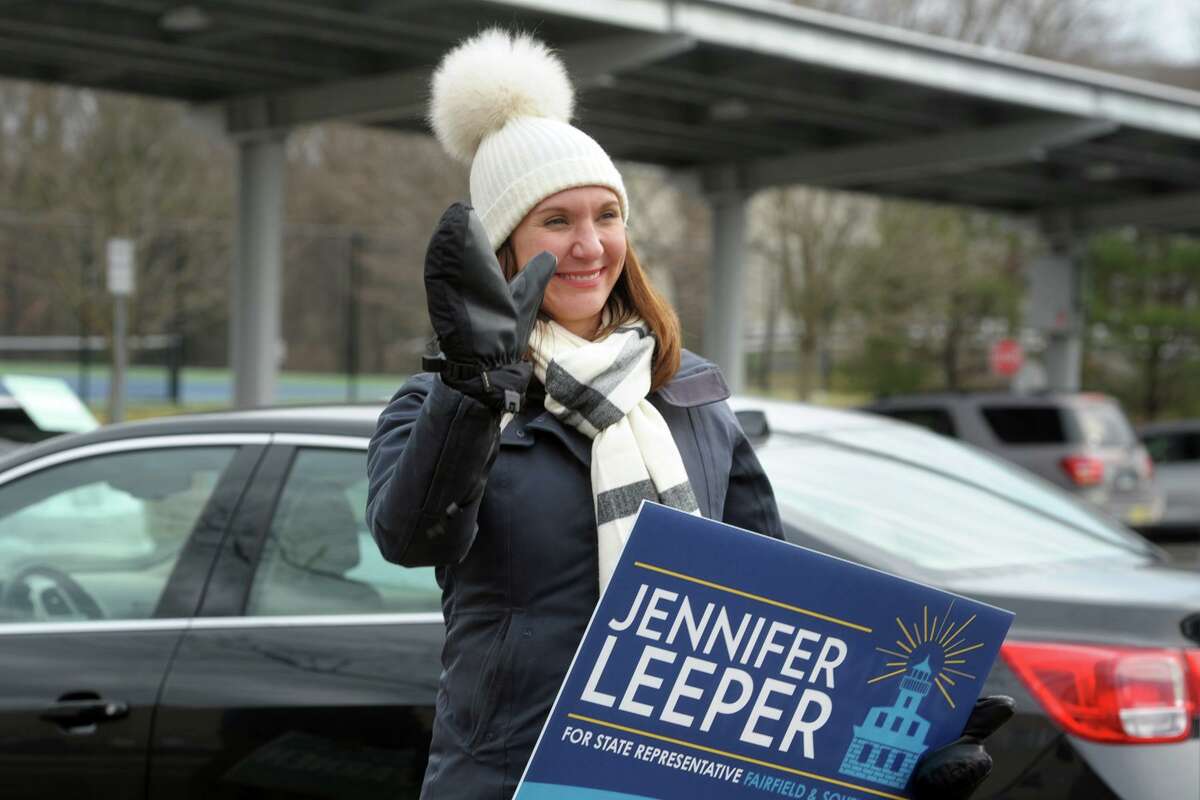 Democrat Jennifer Leeper greets voters outside Fairfield Ludlowe High School on Tuesday. Leeper lost the race for the 132nd state House of Representatives seat to Republican Brian Farnan.