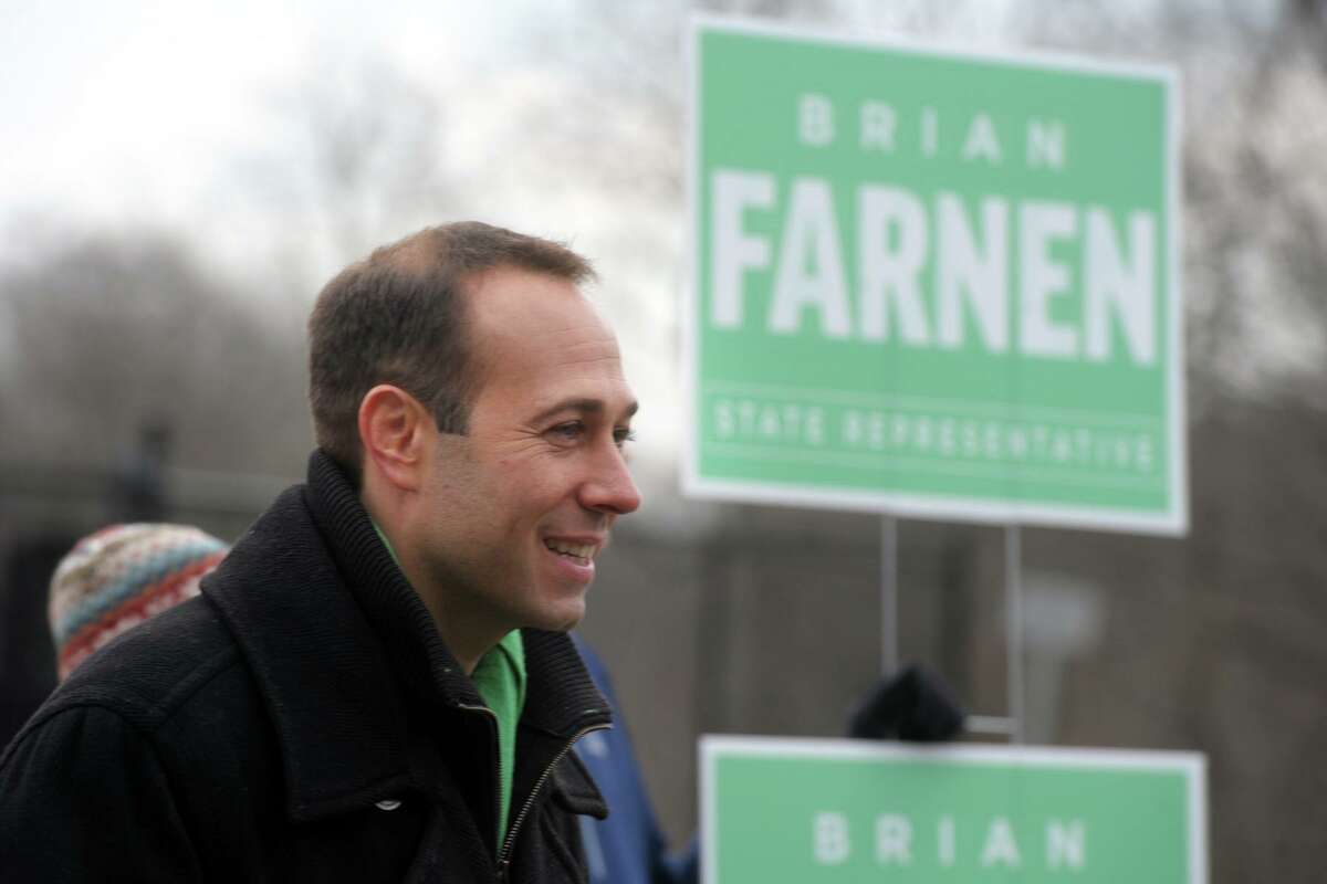 Republican Brian Farnen greets voters outside Mill Hill Elementary School, in Fairfield, Conn. Jan. 14, 2020. Farnen is a candidate for the 132nd House of Representatives seat.