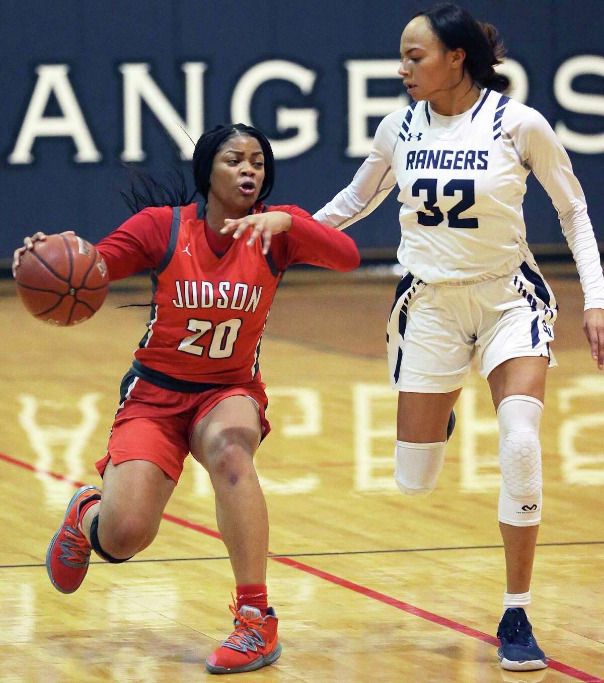 Rocket guard Kierra Sanderlin races into the front court against Brianna Grell as the Smithson Valley girls host the Judson Rockets in girls basketball on Jan. 14, 2020.