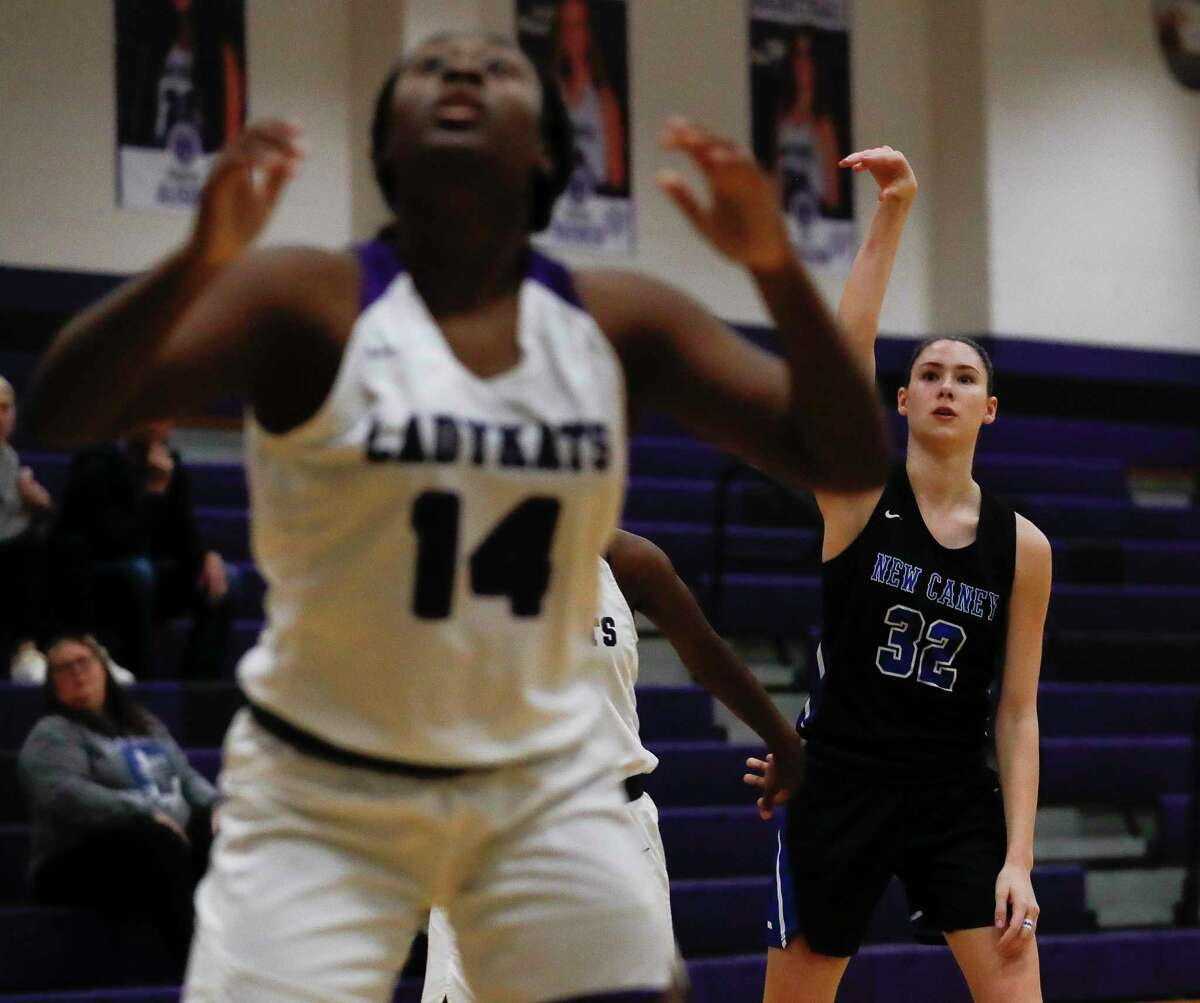 New Caney power forward Tori Garza (32) watches as her 3-pointer hits during the third quarter of a District 20-5A high school basketball game at Willis High School, Tuesday, Jan. 14, 2020, in Willis.