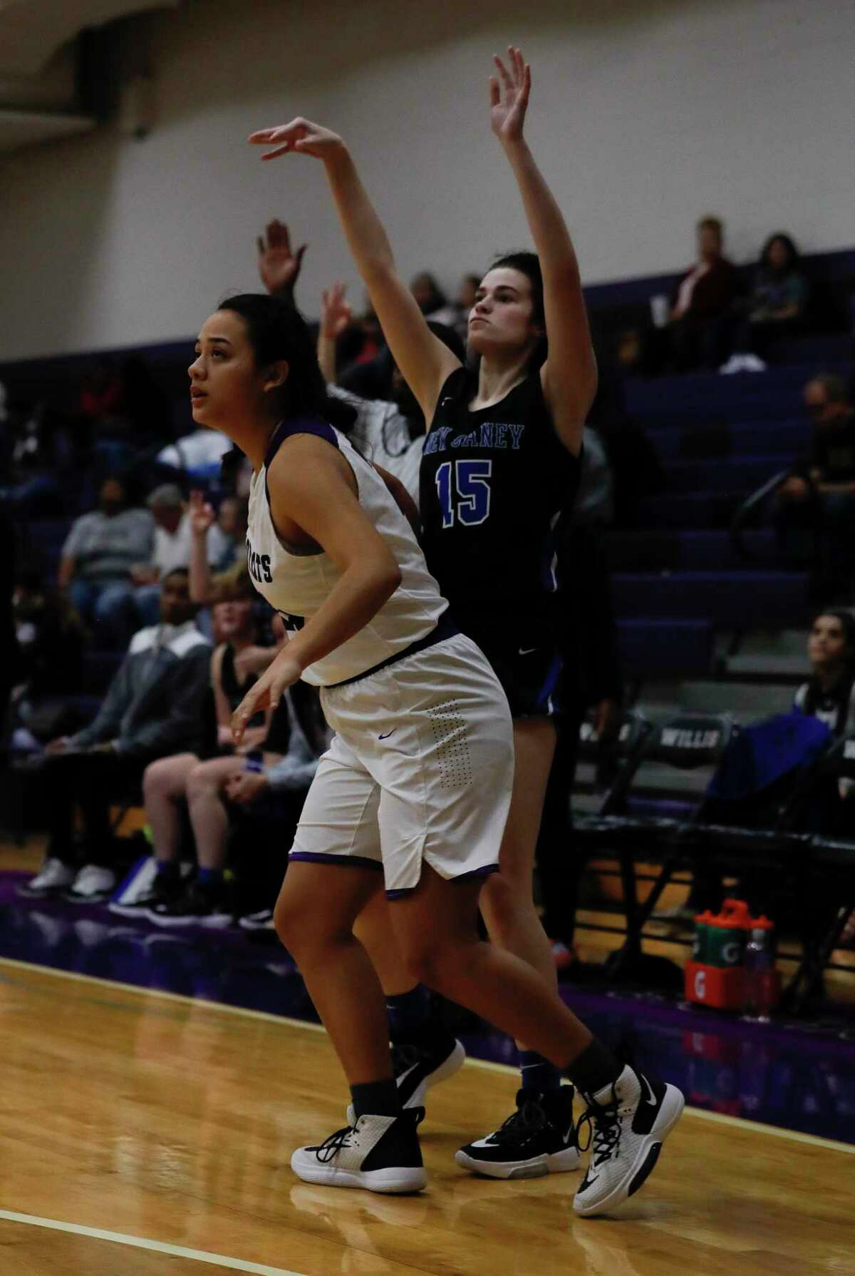 New Caney power forward Michael Mize (15) watches as her 3-pointer falls during the third quarter of a District 20-5A high school basketball game at Willis High School, Tuesday, Jan. 14, 2020, in Willis.