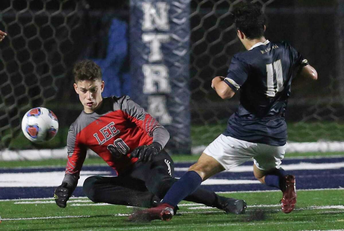 LEE goalkeeper Joey Batrouni (00) defends the goal against Central Catholic's Daveen Mazaheri-Campos (11) in boys soccer at Central Catholic on Tuesday, Jan. 14, 2020. LEE defeated Central Catholic, 1-0, to take the win between the two top rated high school teams.