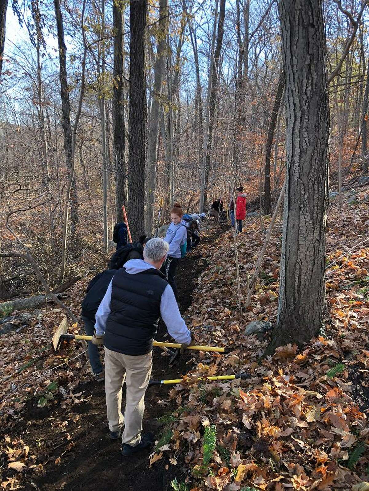 Eagle Scout candidate Tim Porter organized a crew of fellow scouts from Troops 431 and 19 along with some parents to install a new trail through the former Schlumberger property.