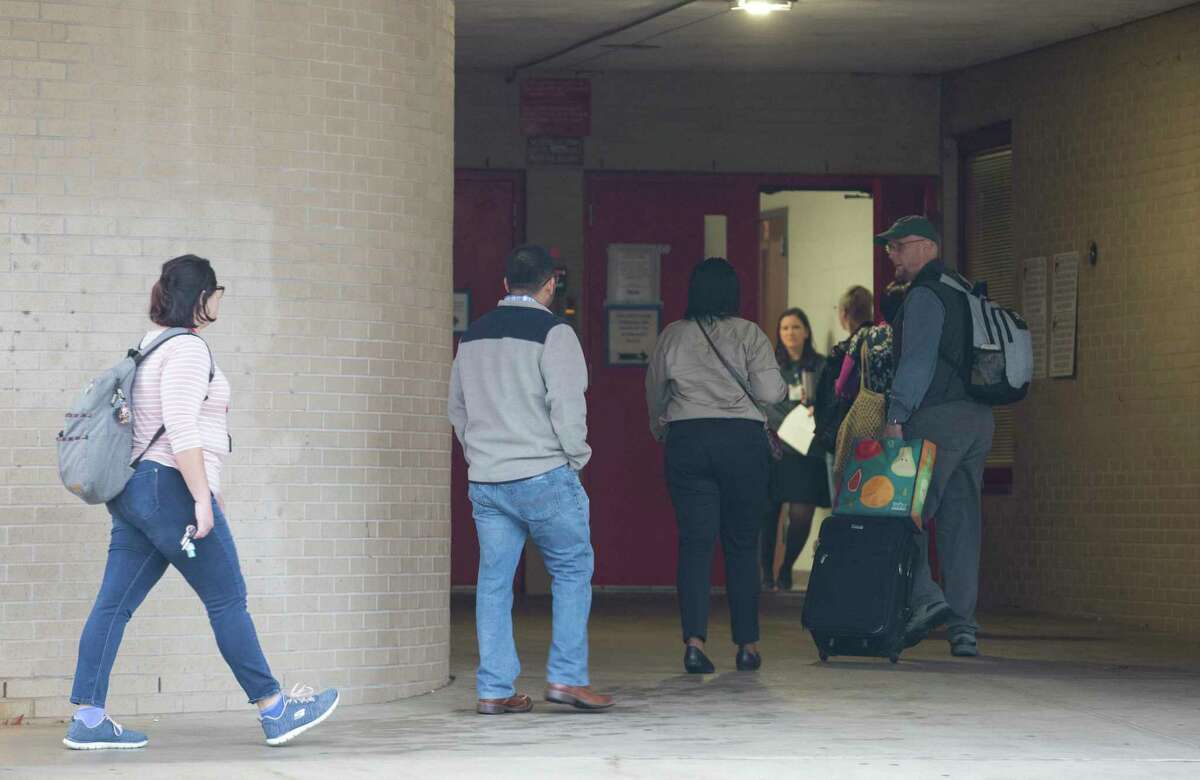 Classes are canceld at Bellaire High School, but teachers and staff return to school after a student was shot on campus and later died at the hospital on Wednesday, Jan. 15, 2020, in Bellaire.