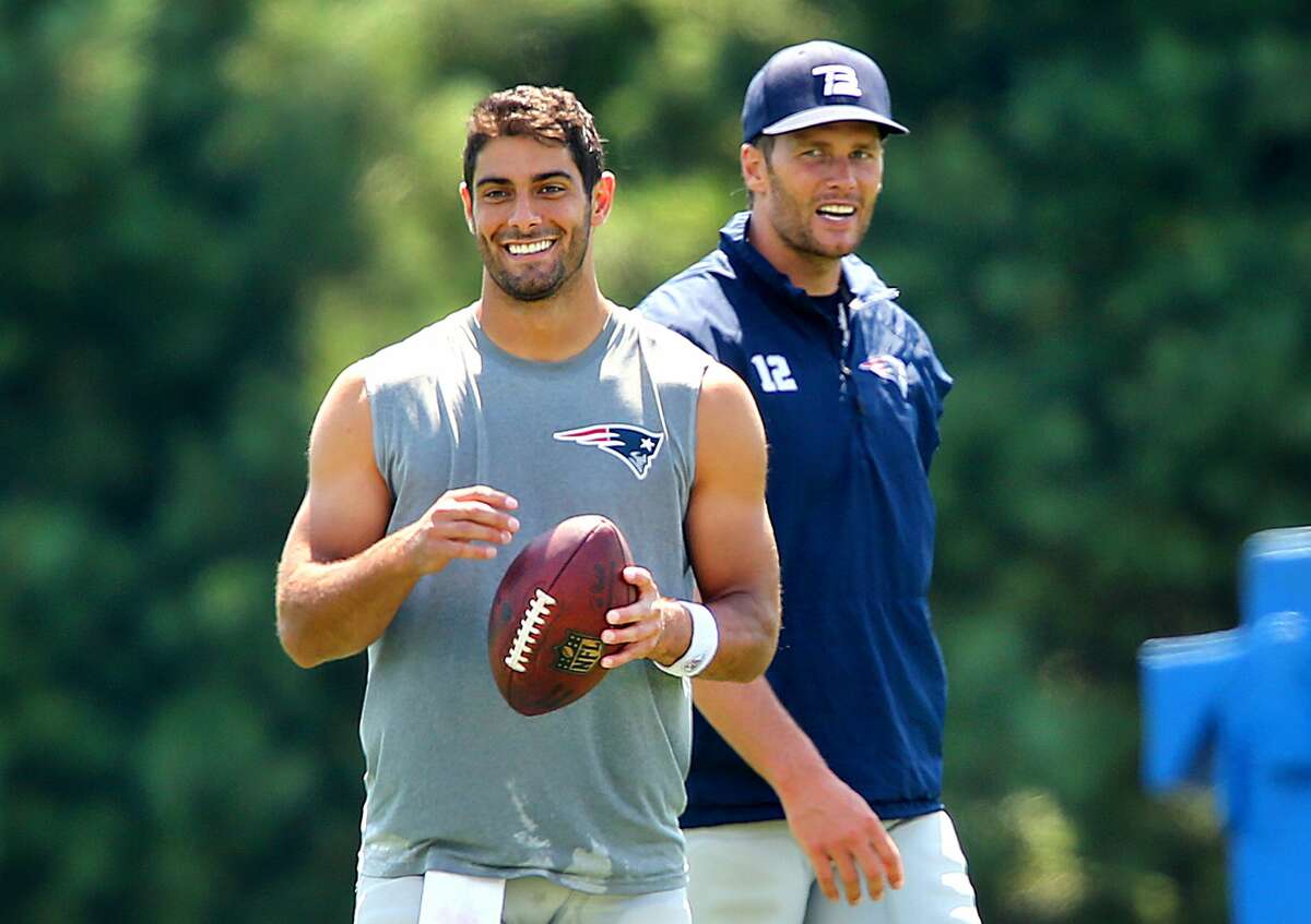 Jimmy Garoppolo and Tom Brady hang out after practice to work together on some long passes. The photo was snapped at New England Patriots training camp on the practice fields behind Gillette Stadium in Foxborough, Mass. on August 3, 2016.