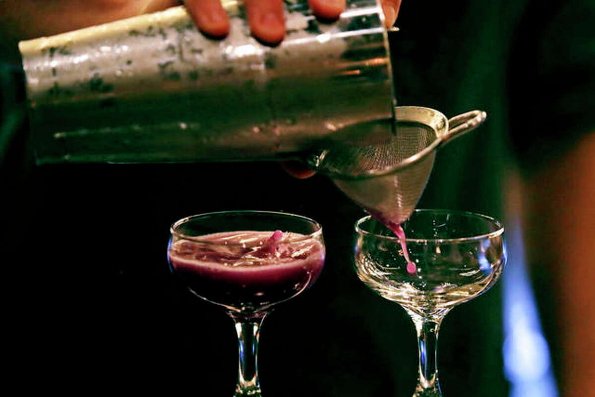 Cocktails are crafted at Wink & Nod, a basement-dwelling, speakeasy-like bar, in Boston. Americans are consuming more alcohol per capita now than in the time leading up to Prohibition, when alcohol opponents successfully made the case that excessive drinking was ruining family life. Charles Krupa | AP