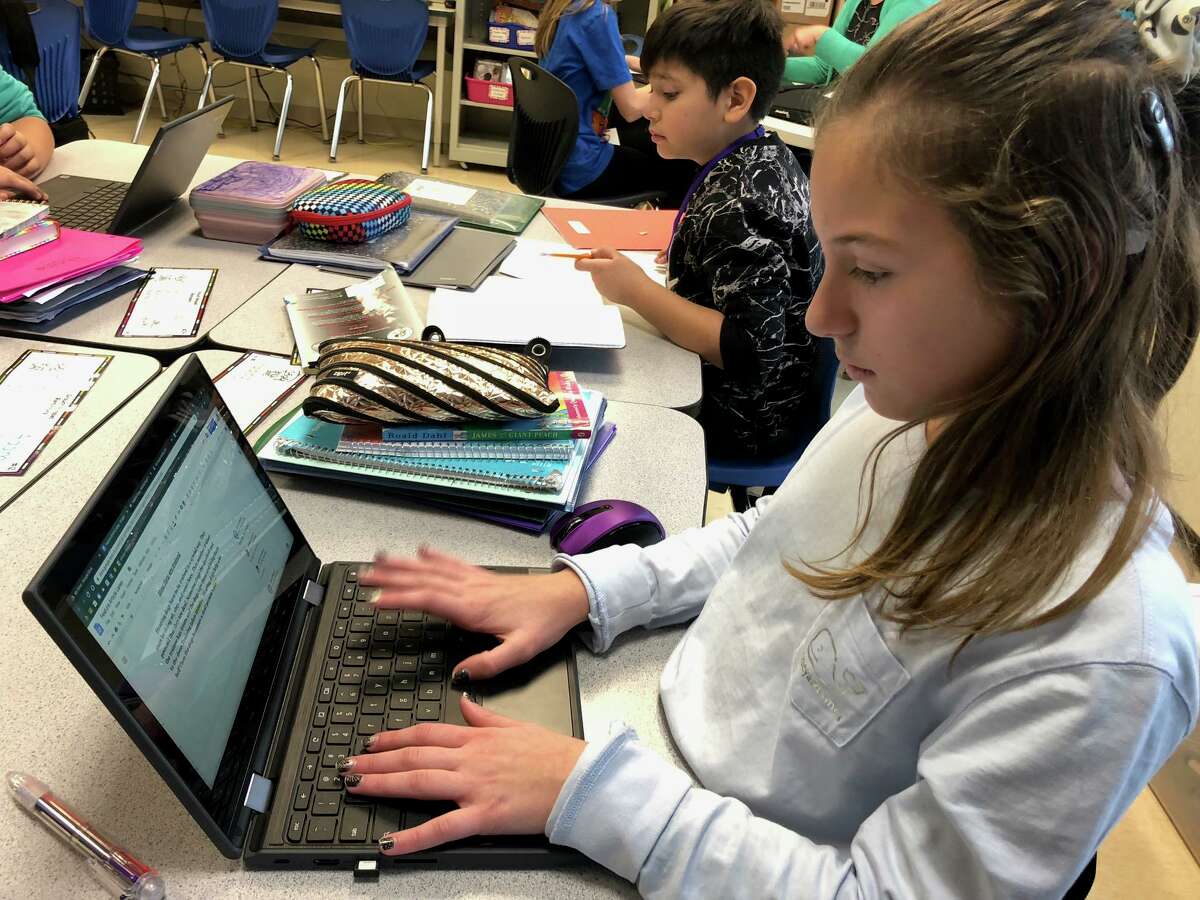 Perry Hill School students Laney Graham and Derek Castanada do work on their Chromebooks last school year.