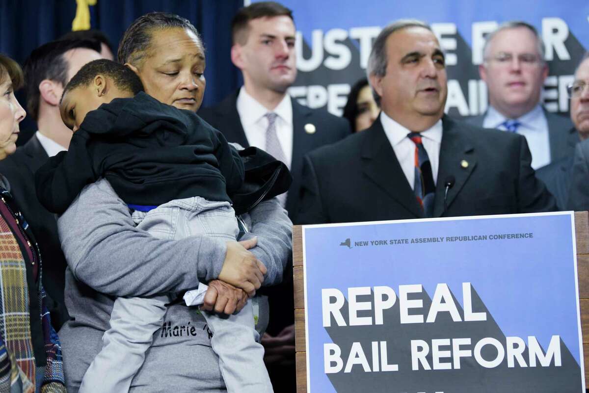 Sheila Harris, left, of Stony Point, holds her son, C.J. Johnson, 4, at a press conference at the Legislative Office Building on Wednesday, Jan. 15, 2020, in Albany, N.Y. Harris was there to talk about her cousin, Maria Osai, a mother of three, who was hit and killed by an unlicensed hit-and-run driver in Rockland County on Christmas Eve. The driver was released without bail. Those attending the press conference were calling on Democrats to repeal the bail reform changes that were enacted January 1st. (Paul Buckowski/Times Union)