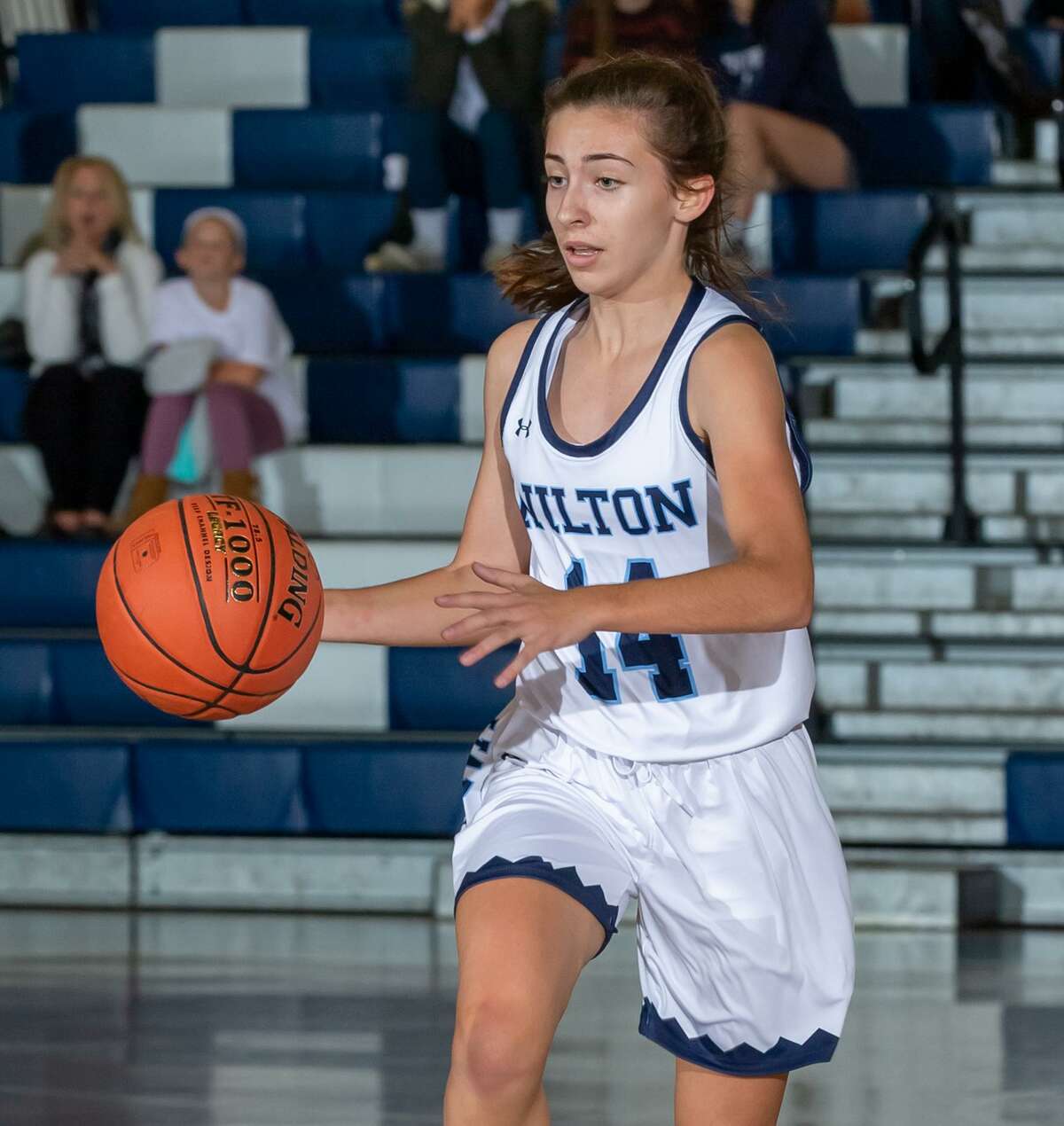 Leah Martins and the Wilton girls hoop team play at Suffield in the first round of the state tournament.
