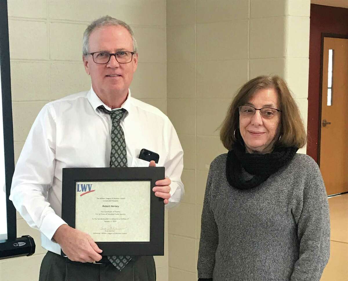 Tina Gardner, convener of the Wilton League of Women Voters, presents a Certificate of Apprectiation to outgoing Wilton Planning Director Bob Nerney, thanking him for his years of service to the town.