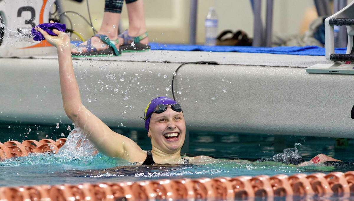 Kaitlynn Sims of Montgomery reacts after setting a Class 5A state record in the girls 500-yard freestyle during the UIL State Swimming & Diving Championships at the Lee & Joe Jamail Texas Swimming Center, Saturday, Feb. 16, 2019, in Austin.