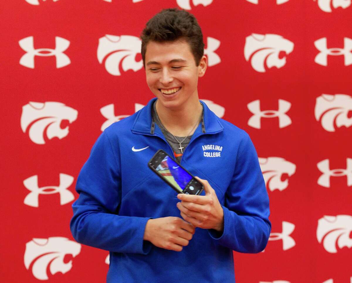 Splendora baseball player Blake Baker shares a laugh after signing with Angelina College during a signing ceremony at Splendora High School, Wednesday, Jan. 15, 2019, in Splendora