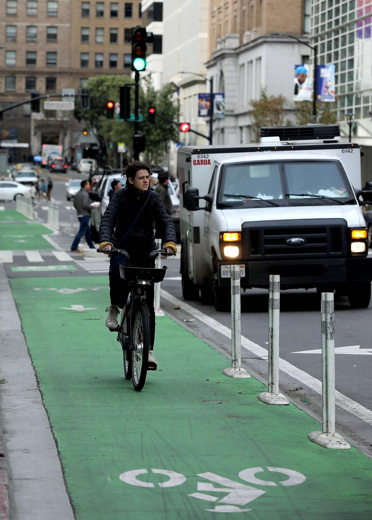 A cyclist travels in the bike lane near Howard and Second, in San Francisco, Calif., on Wednesday, January 15, 2020.
