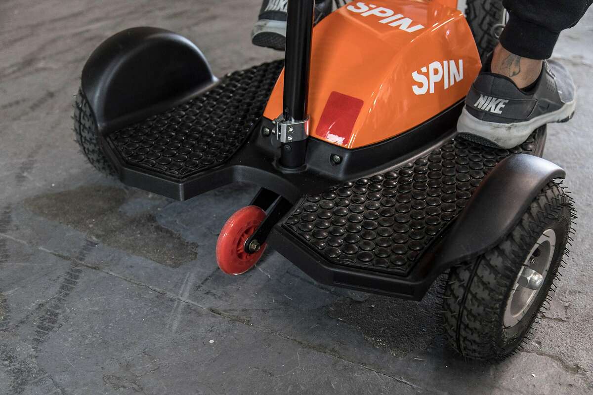 Spin is one of the electric scooter companies that have rolled out new accesibility scooters designed for people with disabilities. The Spin model has three wheels and a seat.