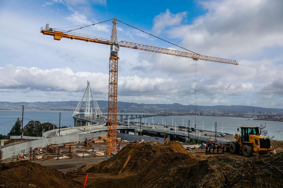 Construction workers begin to build the foundation of a condominium building on Yerba Buena Island on Jan. 14, 2020.