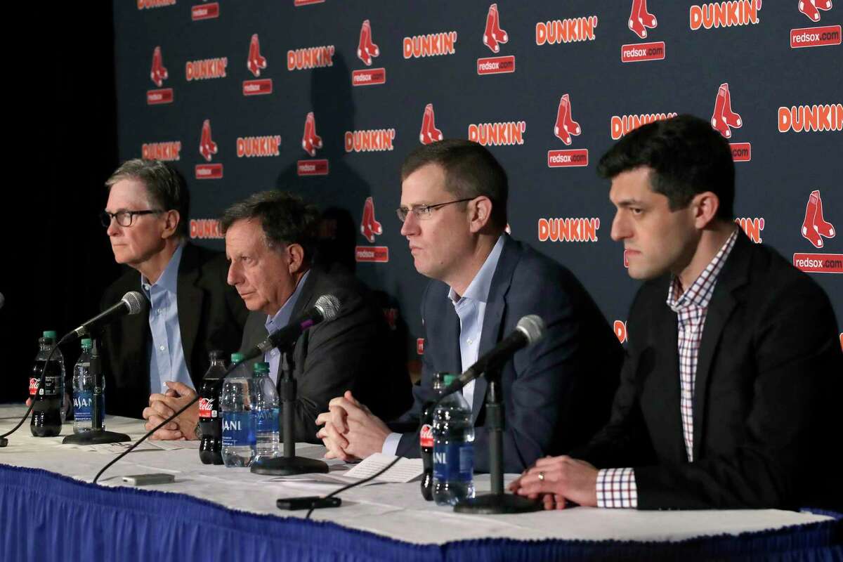 From left, Boston Red Sox owner John Henry, chairman Tom Werner, CEO Sam Kennedy and Chief Baseball Officer Chaim Bloom participate in a baseball news conference at Fenway Park, Wednesday, Jan. 15, 2020, in Boston. The Red Sox have parted ways with manager Alex Cora, with the move coming one day after baseball Commissioner Rob Manfred named him as a ringleader with Houston in the sport's sign-stealing scandal. (AP Photo/Elise Amendola)