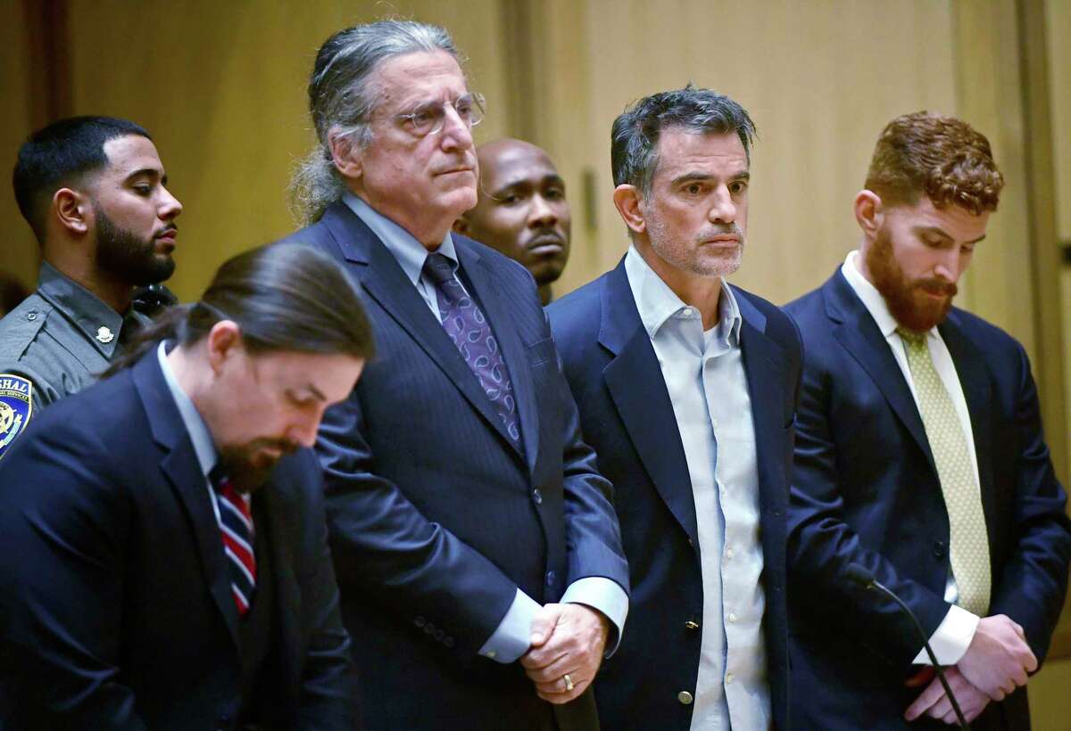 Fotis Dulos, third from left, the estranged husband of Jennifer Dulos, a missing mother of five, is arraigned on murder and kidnapping charges in Stamford Superior Court Wednesday, Jan. 8, 2020, in Stamford, Conn.