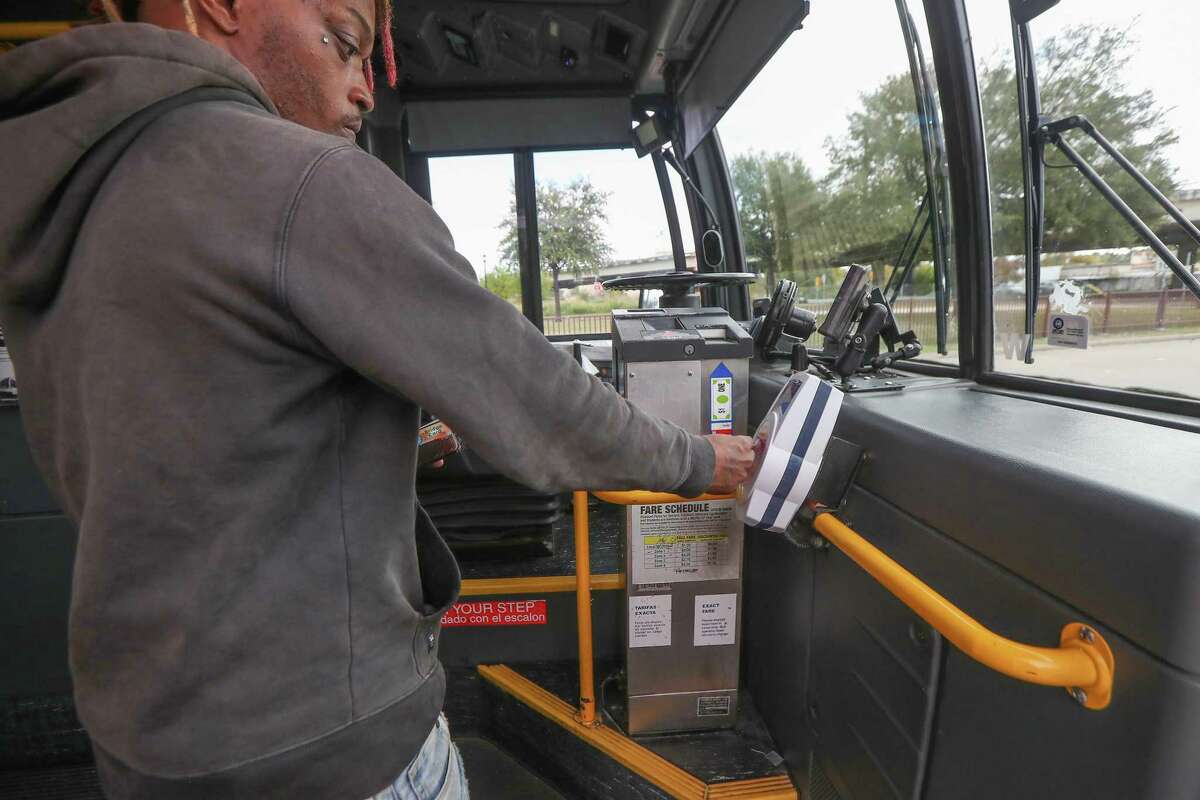 Metropolitan Transit Authority bus riders use Q cards, smartphone apps or cash to hop aboard on Nov. 20, 2019, in Houston. Officials on Wednesday balked at the cost of eliminating fares for riders.
