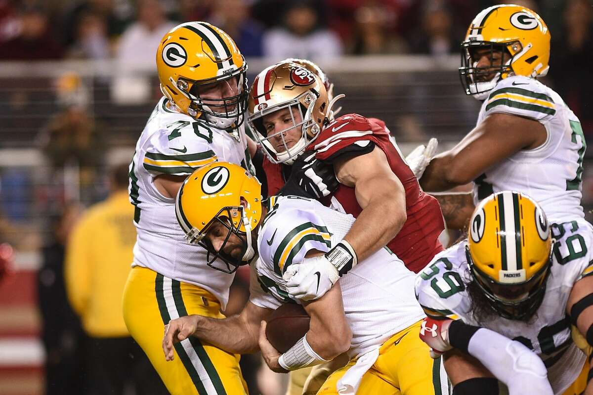 SANTA CLARA, CA - NOVEMBER 24: Green Bay Packers Quarterback Aaron Rodgers (12) is sacked by San Francisco 49ers Defensive End Nick Bosa (97) during the NFL game between the Green Bay Packers and San Francisco 49ers at Levi's Stadium on November 24, 2019 in Santa Clara, CA. (Photo by Cody Glenn/Icon Sportswire via Getty Images)