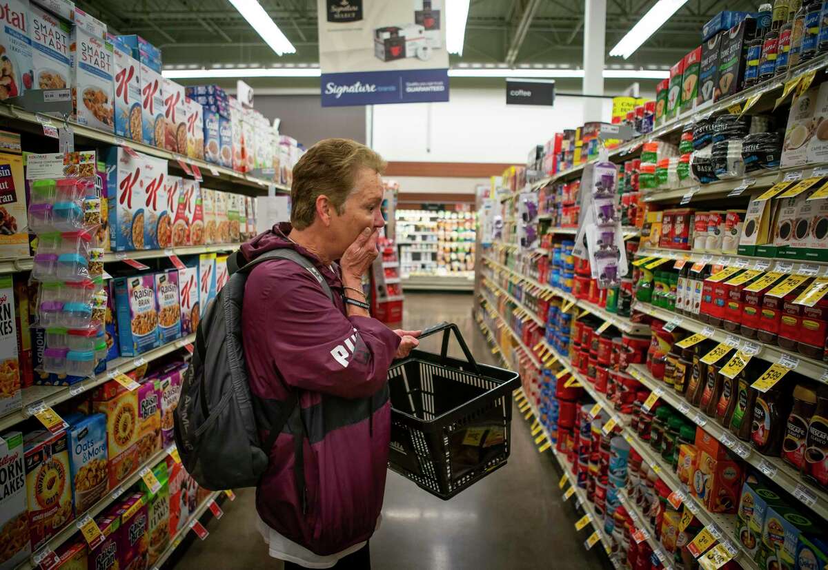 Shari Wilson reacts as she sees all of the coffee choices available while shopping at Randall's. Wilson has spent years only drinking instant while living homeless on Houston's streets.