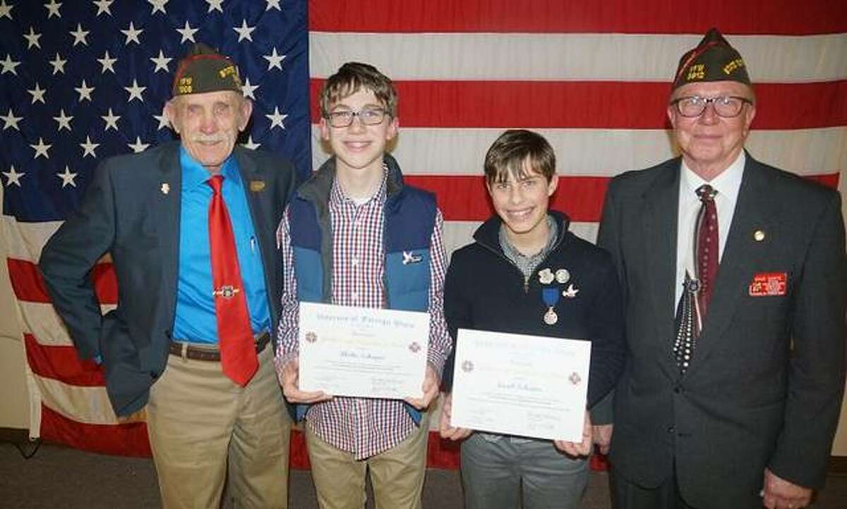 Pictured from left are Dave Stout, Illinois VFW Commander; Blake Schaper, 13, 2nd Place Patriot’s Pen Essay Winner; Jacob Schaper, 14, 1st Place Patriot’s Pen Essay Winner; and Dave Darte, VFW Assistant Youth Activities/Scouting Director.
