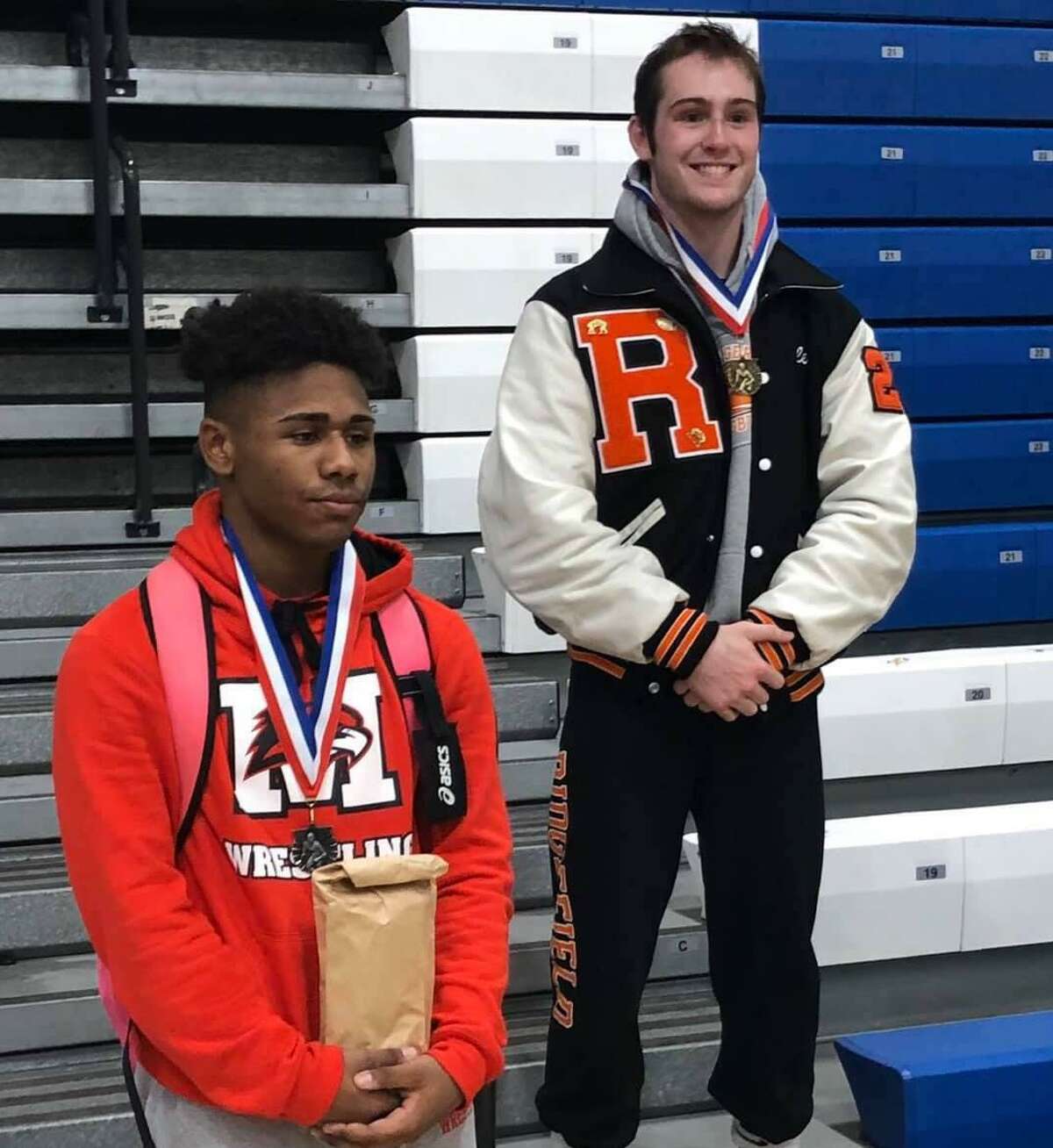 Ridgefield's Liam Keppler, right, won his weight class at the Greater Hartford Open wrestling tournament.