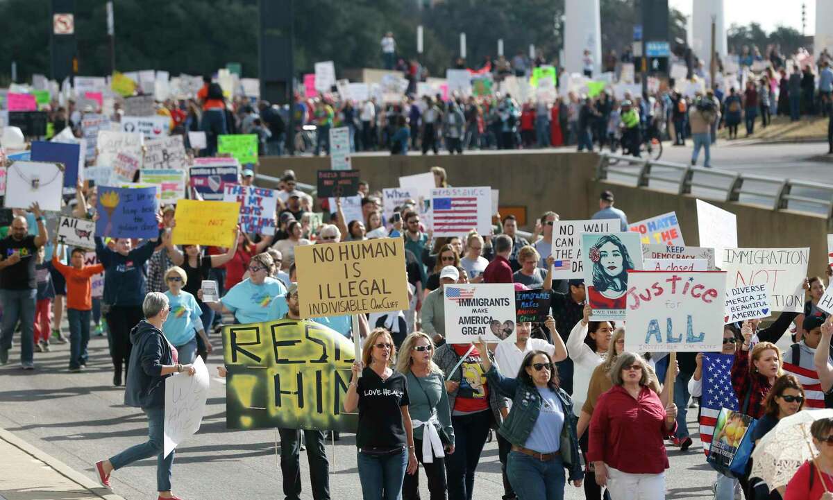 In this Feb. 18, 2017, file photo, protestors rallied in support of immigrants and refugees in downtown Dallas. A federal judge agreed Wednesday, Jan. 15, 2020, to block the Trump administration from enforcing an executive order allowing state and local government officials to reject refugees from resettling in their jurisdictions. U.S. District Judge Peter Messitte in Maryland issued a preliminary injunction requested by three national refugee resettlement agencies that sued to challenge the executive order. Donald Trump's immigration policies.