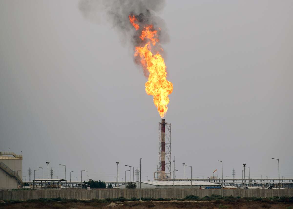 #20. West Qurna Field, Iraq (tie) - Oil reserves (past and future): 14 billion The West Qurna 2 Field in southern Iraq is projected to ramp up production by 20% in 2020, to 480,000 barrels per day under the ownership of Russian energy company Lukoil. ExxonMobil, which purchased the rights to develop Phase I of the field in 2009, added new facilities in June 2019 that allows for production of 465,000 barrels per day. ExxonMobil withdrew its employees from the field for two weeks in 2019 after the U.S. removed all non-essential personnel from its embassy in Baghdad, citing threats from Iran. This slideshow was first published on theStacker.com