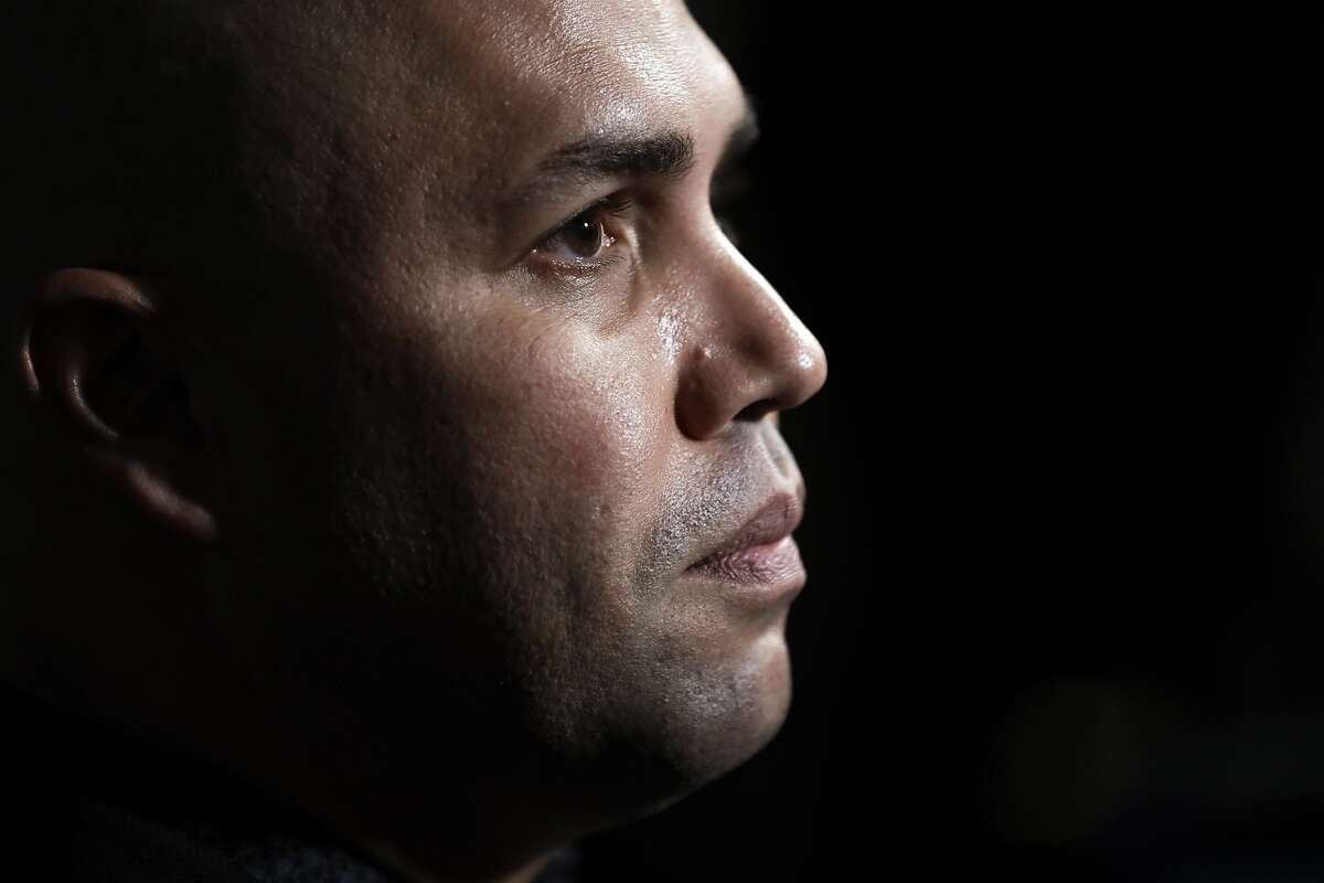 FILE - In this Dec. 10, 2019, file photo, New York Mets manager Carlos Beltran listens to a question during the Major League Baseball winter meetings in San Diego. Beltran is out as manager of the Mets. The team announced the move Thursday, Jan. 16, 2020. (AP Photo/Gregory Bull, File)