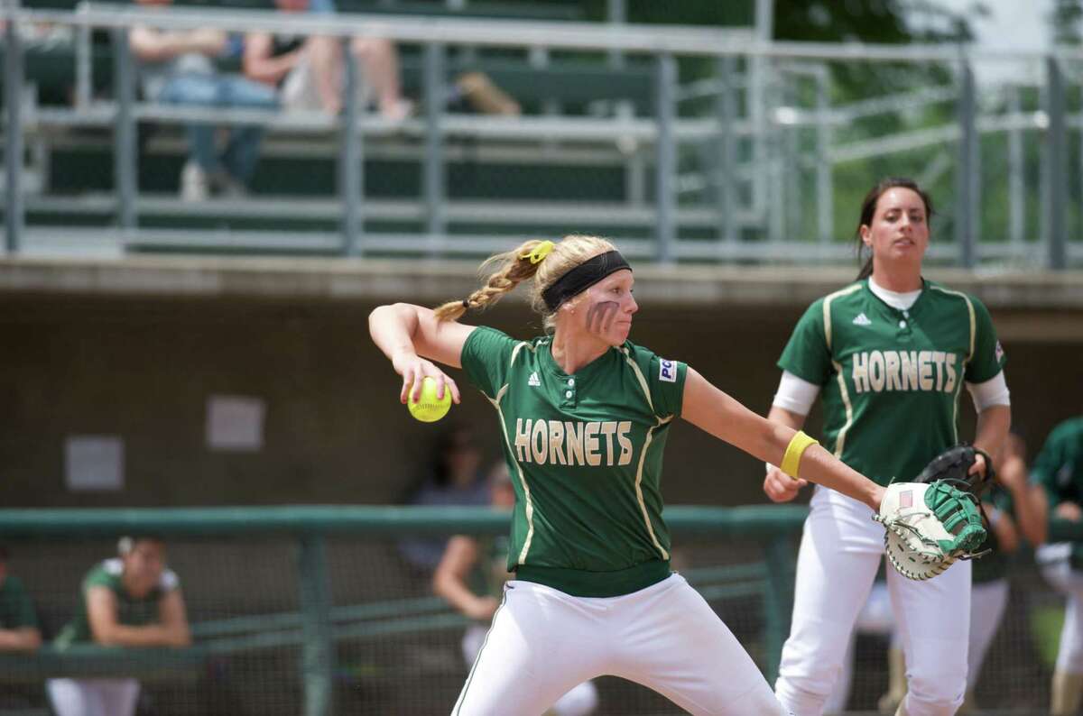 Woodland's Alyssa Nakken coaches Giants' first base, players kneel