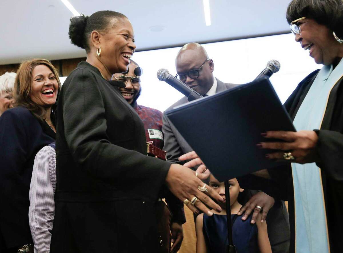 Patricia Allen is congratulated by her mom, Texas Rep. Alma Allen, during the swearing-in ceremony for the four newly elected Houston ISD trustees Thursday, Jan. 16, 2020 in Houston.