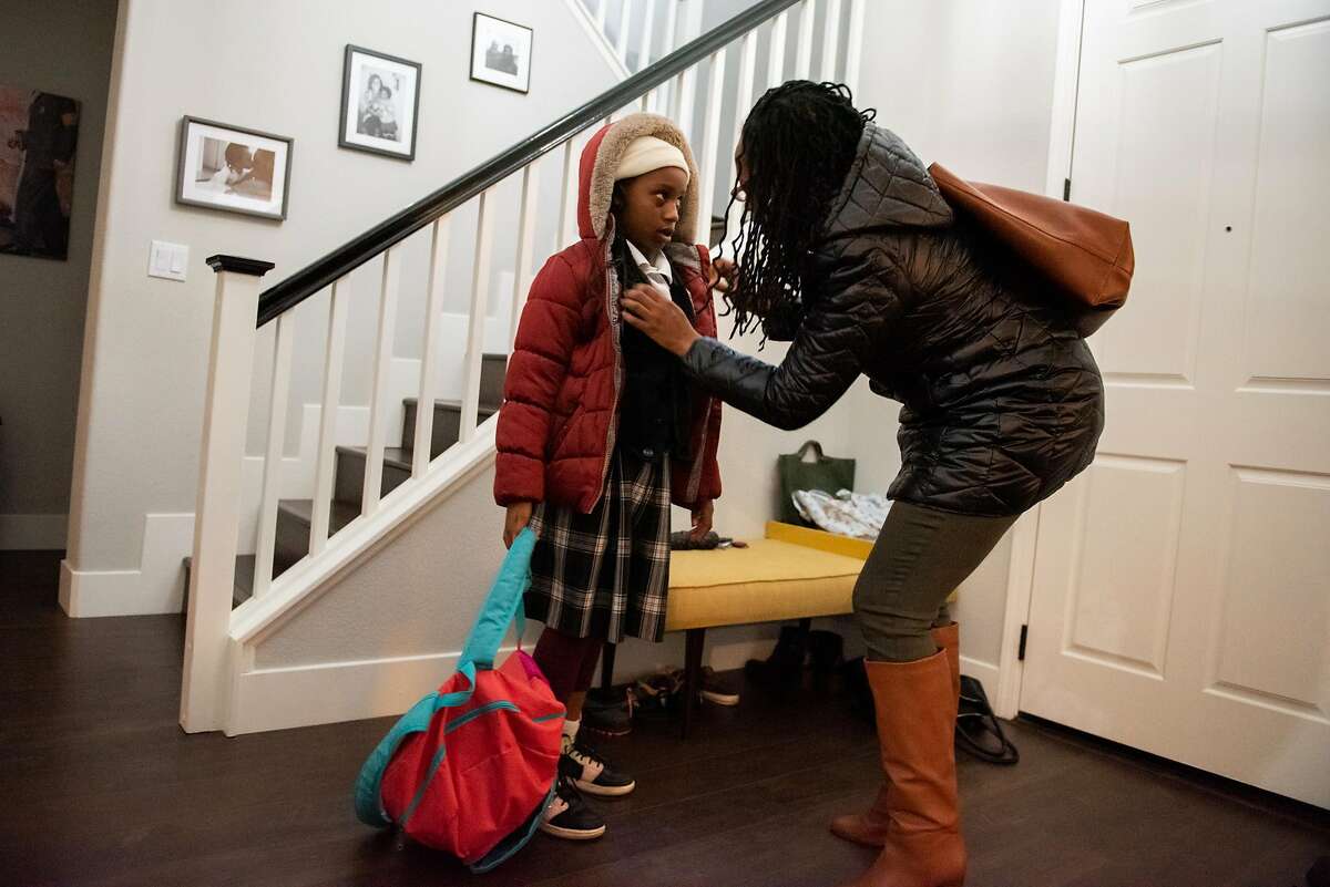 Lateefah Simon, BART's new board president and a single mom who is legally blind, gets her daughter Lelah ready for a Lyft ride to pick them up in order for Lelah to get to school on January 16, 2020 in Richmond, Calif.