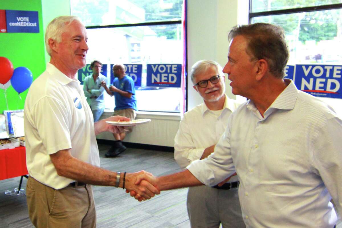 Then-gubernatorial candidate Ned Lamont, right, greets former Bridgeport Mayor Bill Finch as Lamont celebrates with supporters at the opening of a campaign office in Bridgeport in 2018.