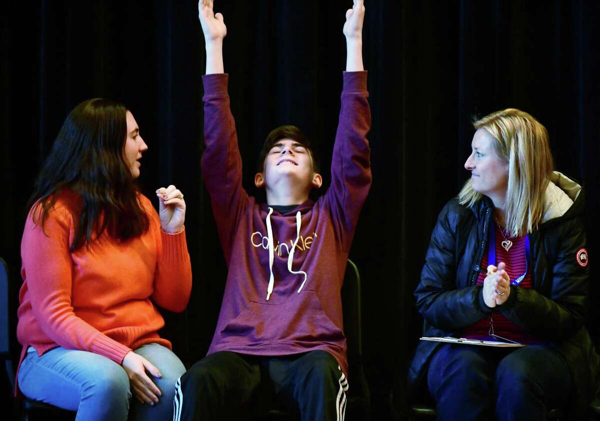 8th grader Sean Tagariello reacts to winning first place as Social Studies teachers Amy Jones and Bonnie Jessup look on as 18 Nathan Hale Middle School students in grades 6, 7 and 8 compete in the schools annual National Geographic Geography Bee Friday morning January, 17, 2020, at the school in Norwalk, Conn. The winning student will go on to compete at the state geography bee. State winners go on to nationals this summer.